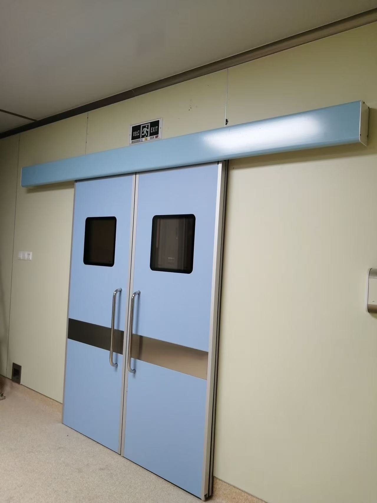 Hospital automatic door in blue clean corridor