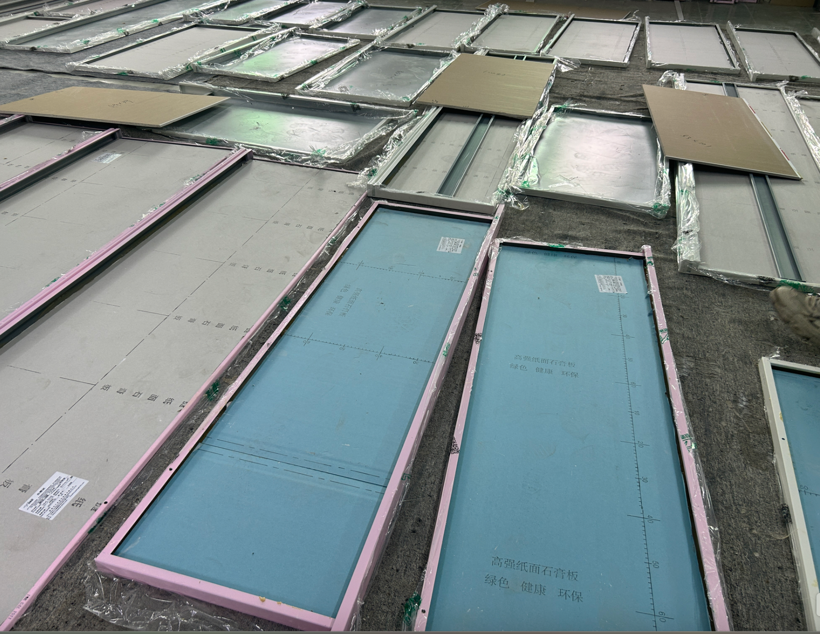Hot-dip galvanized steel wall panels with backing boards in production