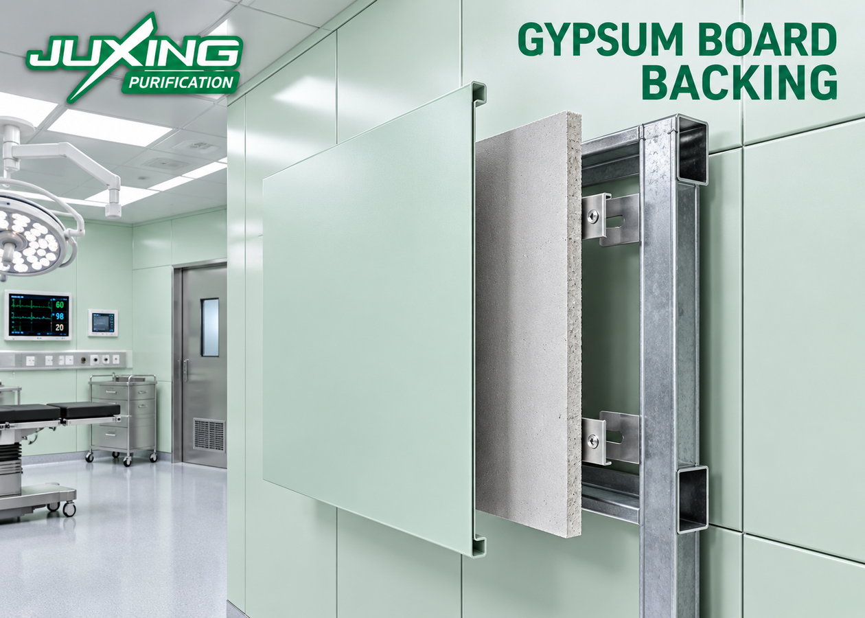 Gypsum board backing behind stainless steel operating theater wall panels